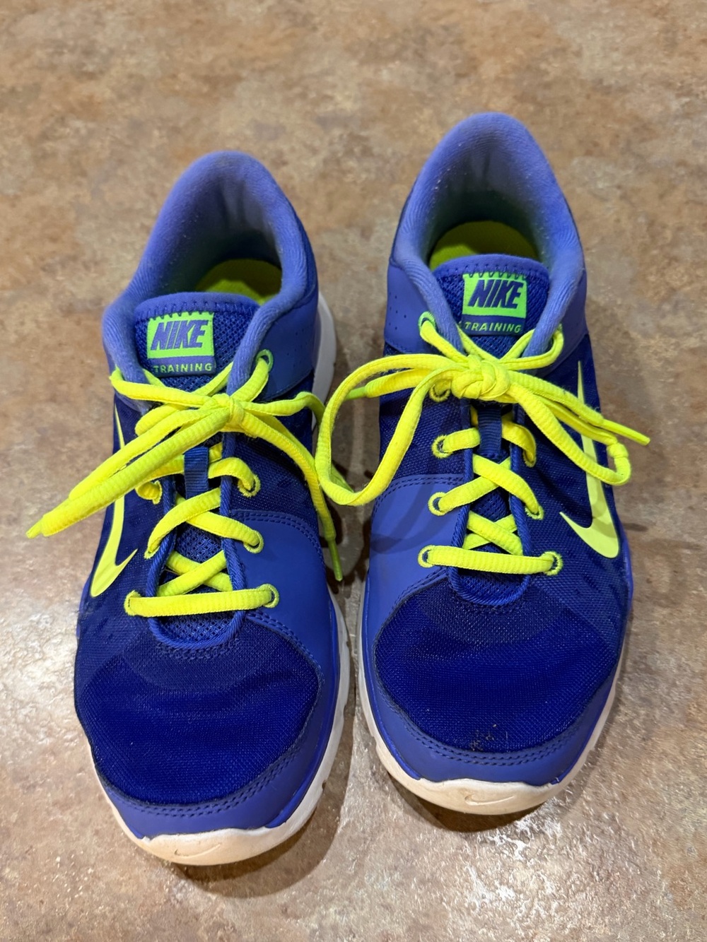 Nike  Blue & Neon Yellow Training Shoes. Has small hole in each shoe. Size 8